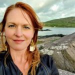 Anna Brittain in front of rocks and water